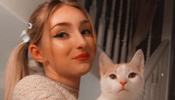 young woman holding a rescue cat © RSPCA