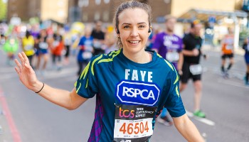 RSPCA runner at the cheer station during the London Marathon