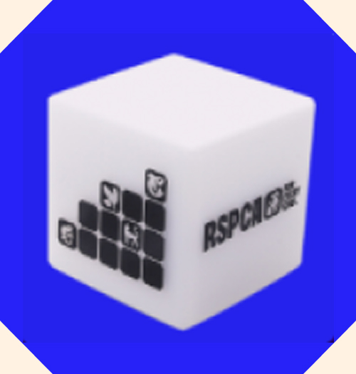 A small light up cube with the RSPCA logo on it.