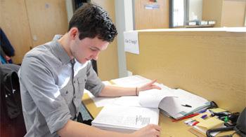 Volunteer Richard Burn doing paperwork in head office