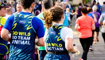 RSPCA marathon runner and supporters