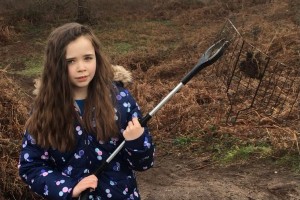Susie holding litter picker