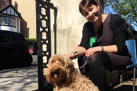    Caroline Lucas with her dog at the polling station