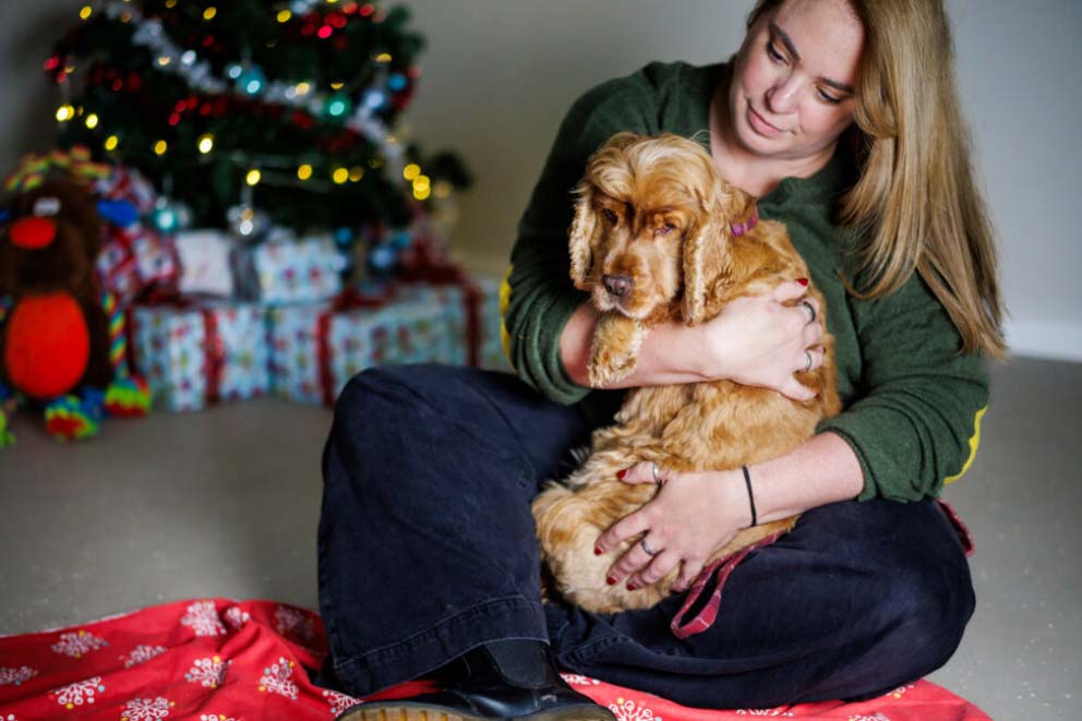 Sara cuddling rescued dog Betty.