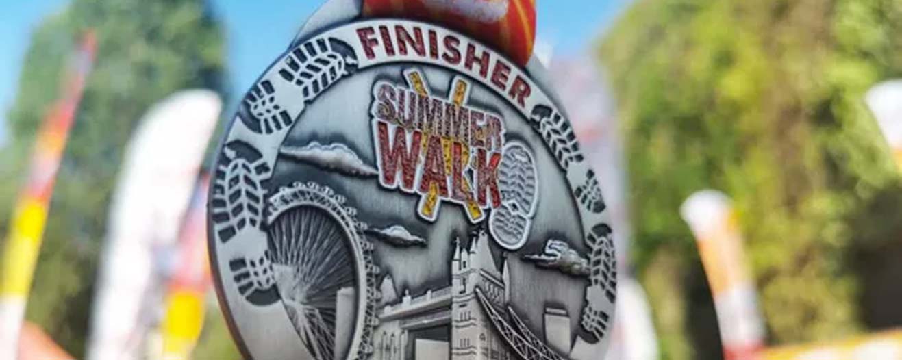 A close-up of the Summer Walk Finisher medal.