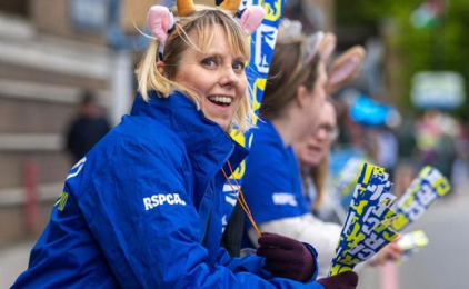 RSPCA fundraisers cheering on runners at the London marathon.