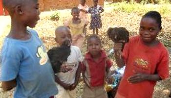 Boys bringing chickens to LSPCA clinic in Malawi