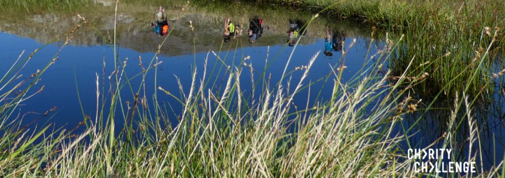 water reflection of people trekking through countryside © RSPCA