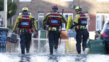 RSPCA Animal Rescuers wading through water