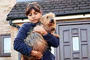 RSPCA animal rescuer holding dog