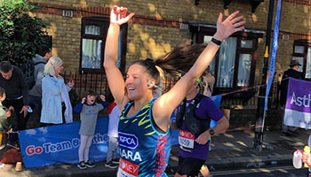 RSPCA marathon runner arms up