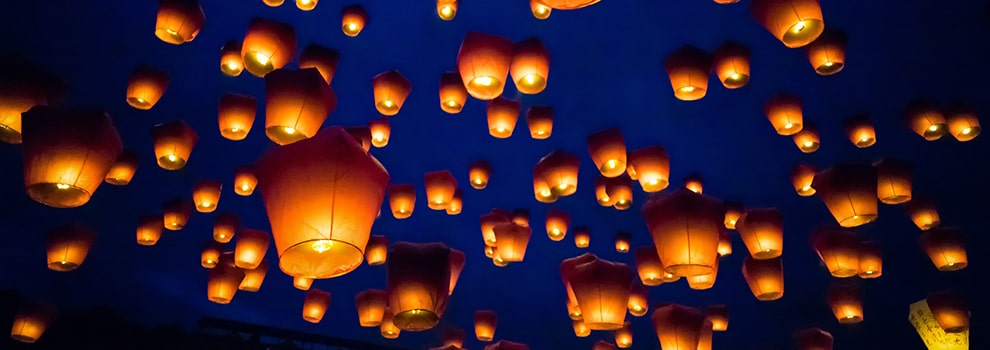 Sky lanterns being released at night