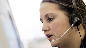 close-up of woman in a call centre wearing a headset