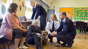 RSPCA inspectors in a classroom with other adults © RSPCA