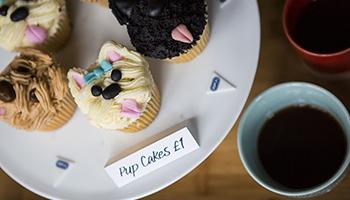 A selection of cupcakes and coffee