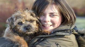 young woman hugging dog © RSPCA