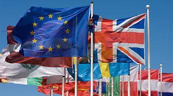 flags in the wind with eu and union jack at the front © iStock